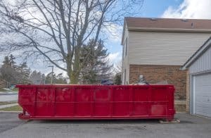 Red Dumpster Bin on the Driveway
